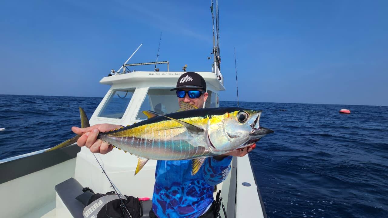 Crew preparing bait and tackle before departure