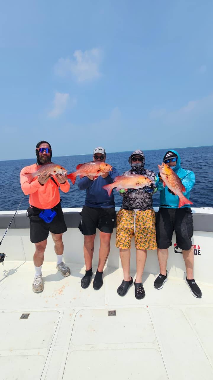 Guests enjoying their offshore catch on deck